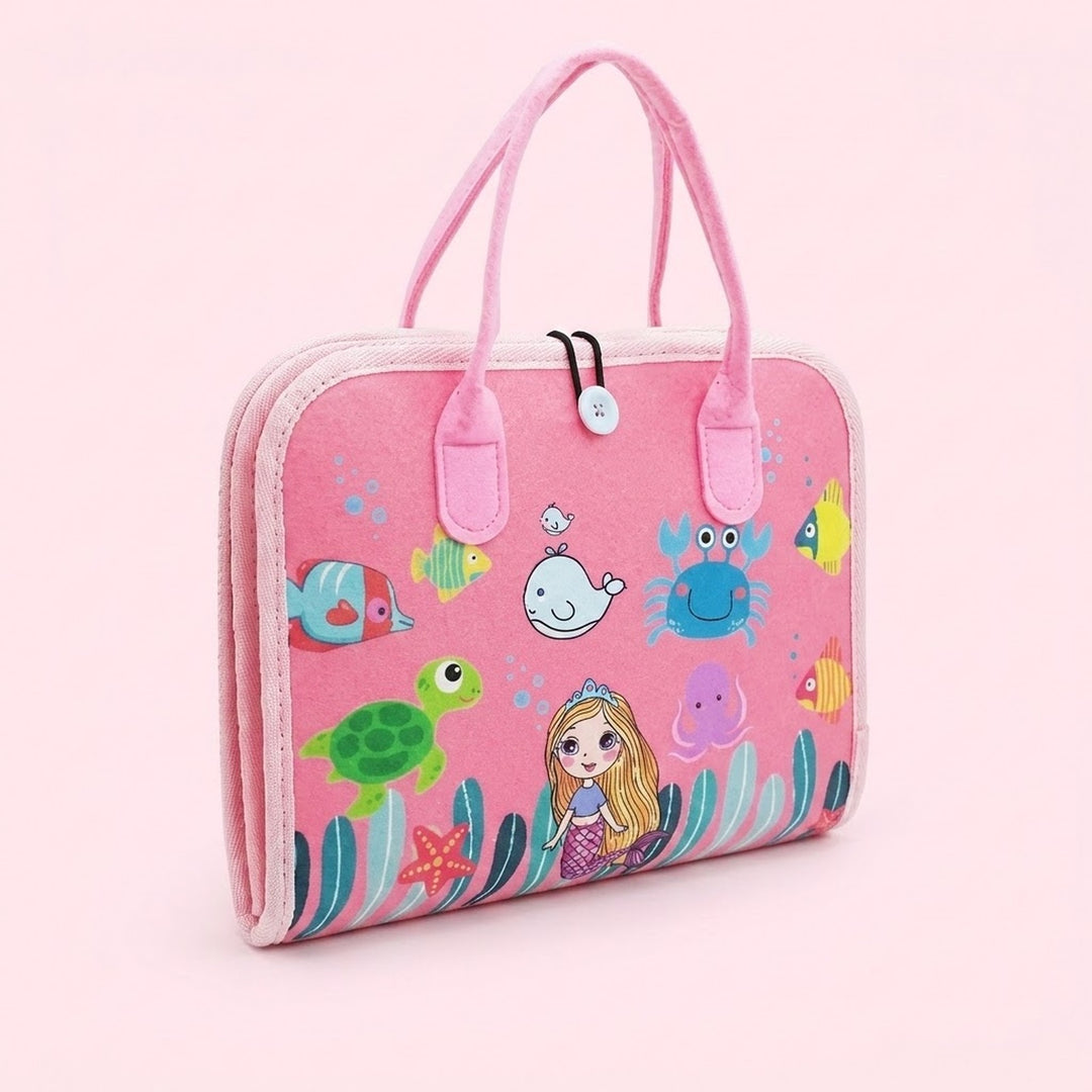 Closed pink felt busy board with carrying handles features a mermaid and colorful sea creatures against a pale pink background.