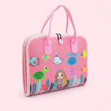 Closed pink felt busy board with carrying handles features a mermaid and colorful sea creatures against a pale pink background.