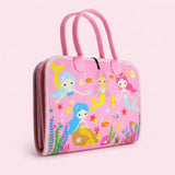 Pink felt busy board shown closed with carrying handles and colorful mermaid illustrations against a pale pink background.