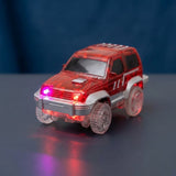 A translucent red toy SUV with clear wheels and glowing red and pink lights, displayed on a dark reflective surface against a dark blue background.