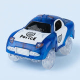 A blue and white toy police car with clear plastic wheels, featuring 'POLICE' text and shield emblems on the hood and side door, set against a light blue background.