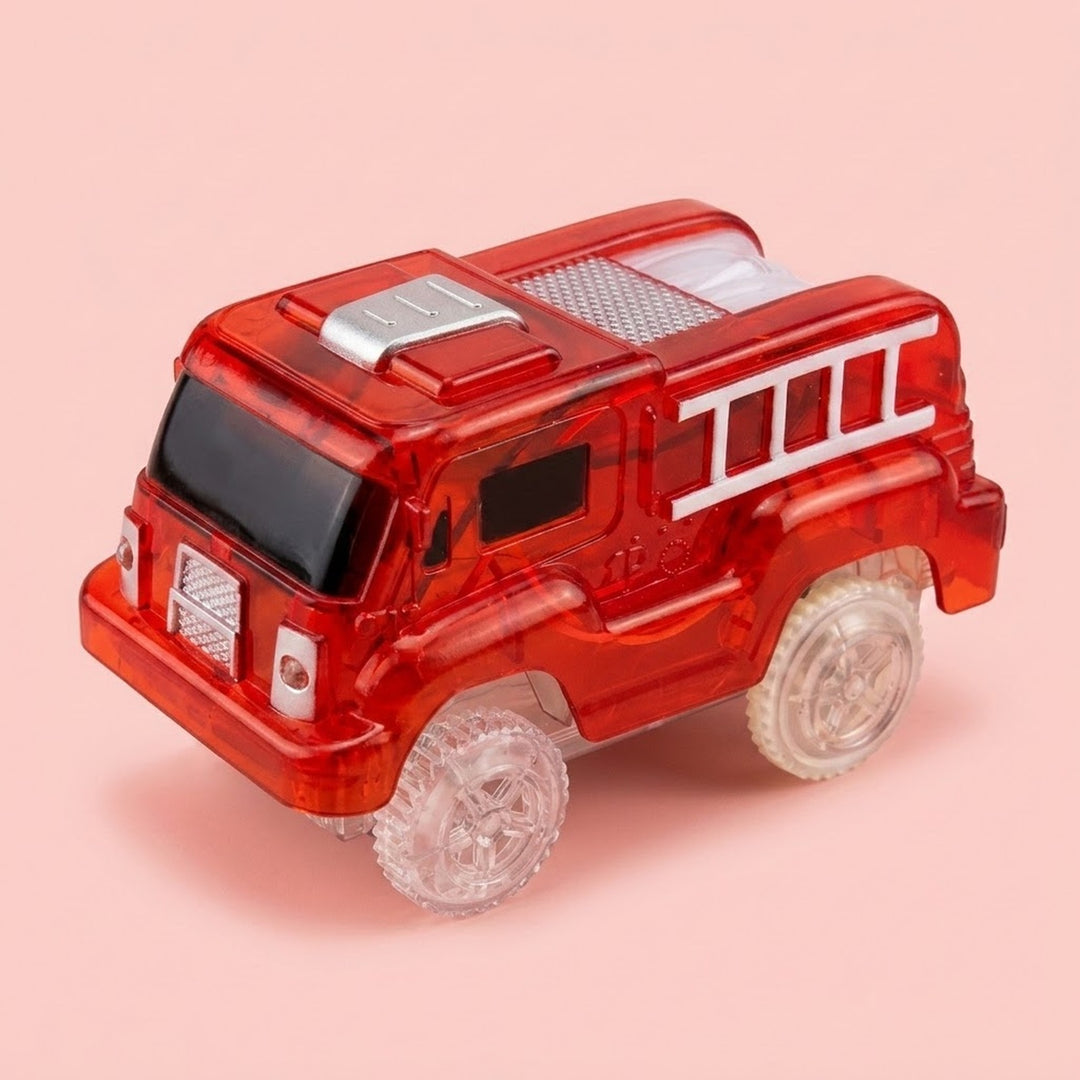 A translucent red toy fire truck with clear wheels and white ladder details, photographed on a solid light pink background.