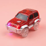 A red translucent toy SUV with clear plastic wheels and glowing pink and red lights, set against a solid pink background.