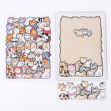 Partially assembled wooden cat jigsaw puzzle with loose irregular pieces below and a matching reference drawing alongside on white.