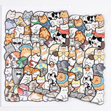 Colorful wooden cat jigsaw puzzle overlapping its matching reference drawing on a white background, with irregular cat-shaped edges visible.