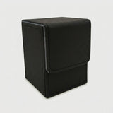 A black textured deck box with gray edging and a closed fold-over flap stands against a light gray background.