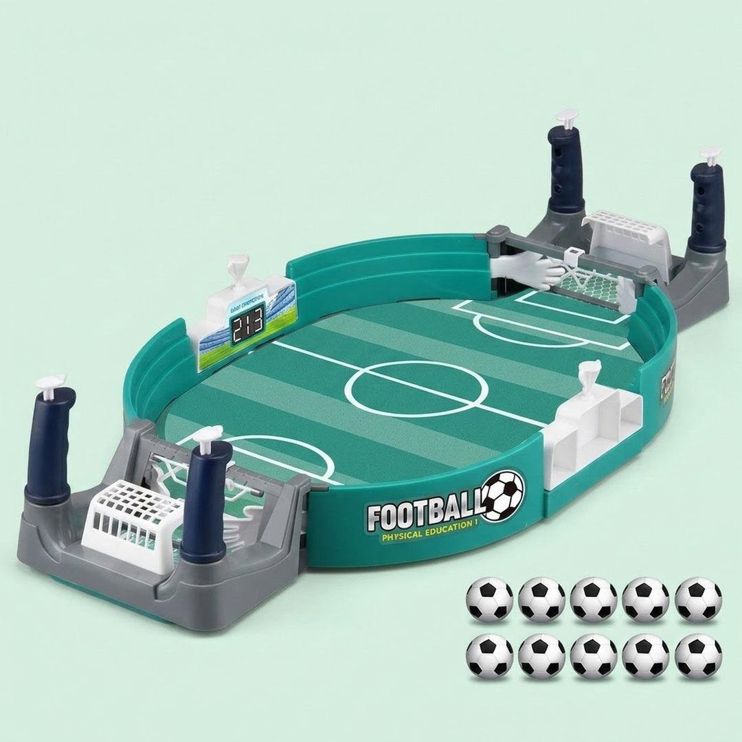 Teal tabletop soccer game with gray goals, a side scoreboard, and ten balls arranged beside it against a pale mint background.
