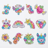 Diamond painting kit with twelve colorful gem stickers featuring unicorns, rainbows and fantasy characters arranged in three rows on white.