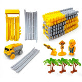 Race track set includes yellow and gray tracks, a dump truck, barrier, sign, worker figure, and three palm trees on white.