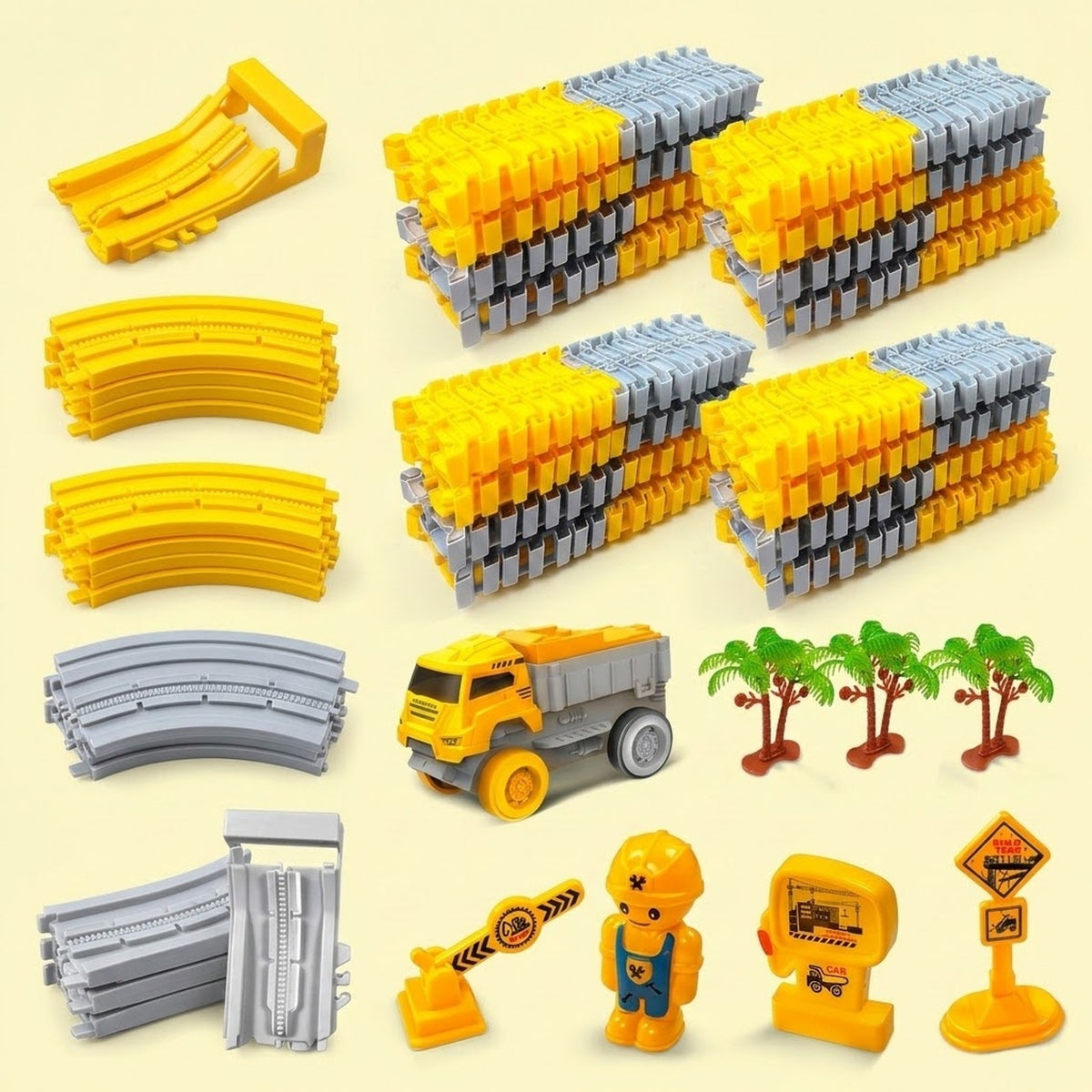 Yellow and gray race track set with four stacks of plastic sections, a dump truck, and accessories on a pale yellow background.