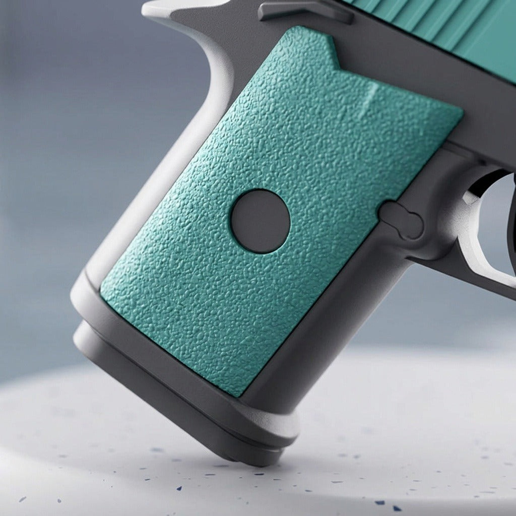 A close-up shows the water gun's textured turquoise grip, circular grey inset, and grey frame against a muted grey background.