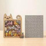 A wooden cat-shaped puzzle with colorful cat pieces stands beside a gray rectangular jigsaw on a light wooden surface against a cream background.