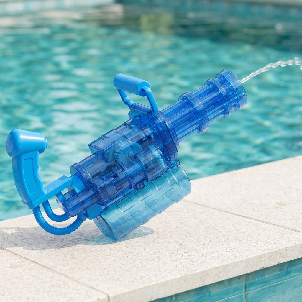 A transparent blue electric water gun rests on pale swimming pool coping while spraying a stream of water.