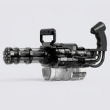A transparent black electric water gun with black handles and a clear lower reservoir stands against a light grey background.