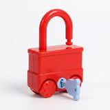 A red vehicle-shaped lock puzzle shows its plain reverse side, open shackle, and inserted pale blue key against a white background.