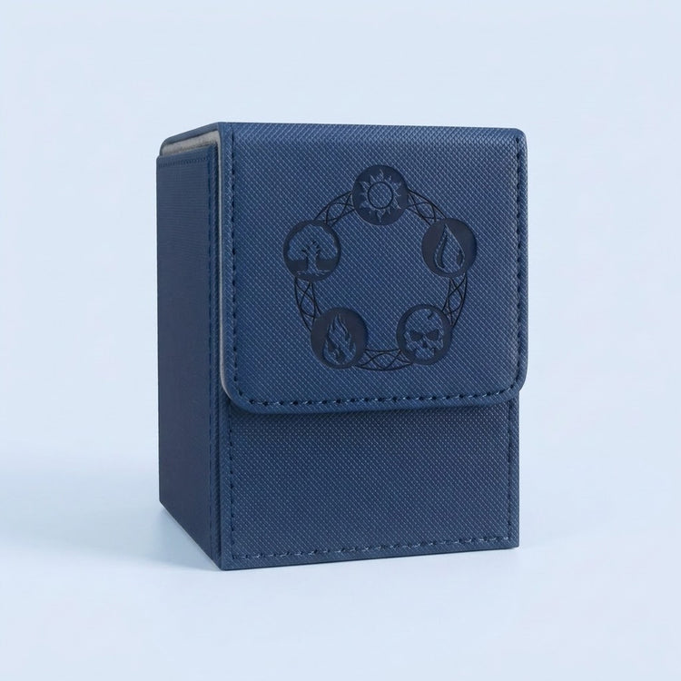 Blue textured card deck box with gray lining, stitched edges, and dark embossed symbols on its front flap against a pale blue background.