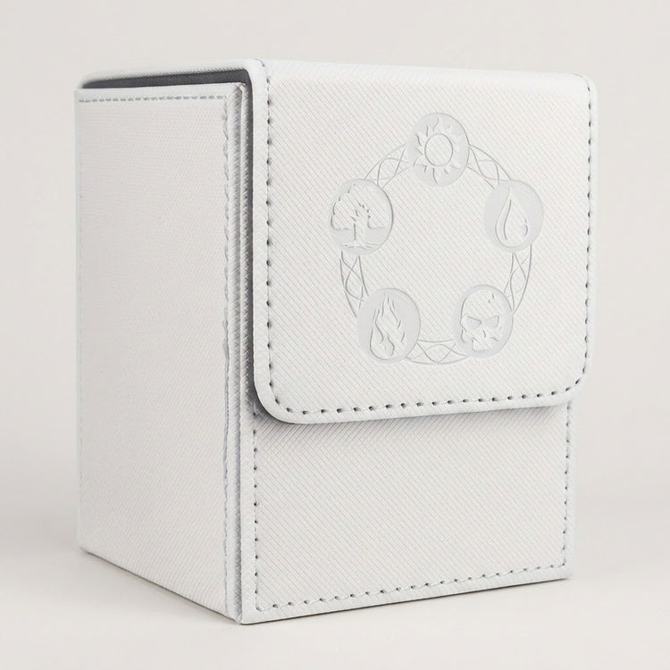 White textured card deck box with gray lining, stitched edges, and embossed circular symbols on its front flap against a pale background.