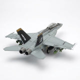 Assembled gray plastic aircraft model kit viewed from above and behind, showing twin exhausts and numbered wings against white.