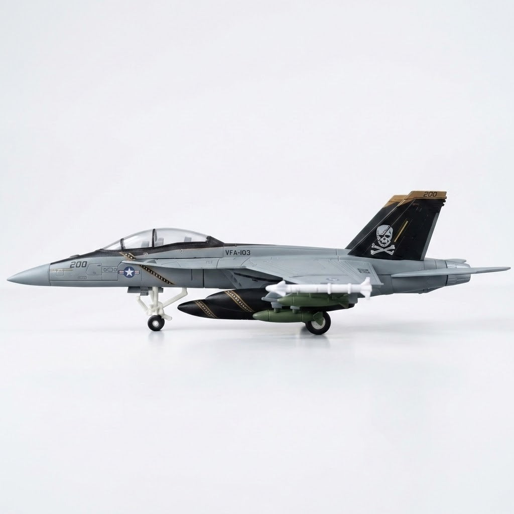 Assembled gray plastic aircraft model kit in side profile, with clear canopy, pirate tail marking, and extended landing gear against white.