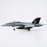 Assembled gray plastic aircraft model kit in side profile, with clear canopy, pirate tail marking, and extended landing gear against white.