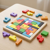 A wooden tangram puzzle with colorful fitted blocks and loose geometric pieces sits on a pale wooden table.