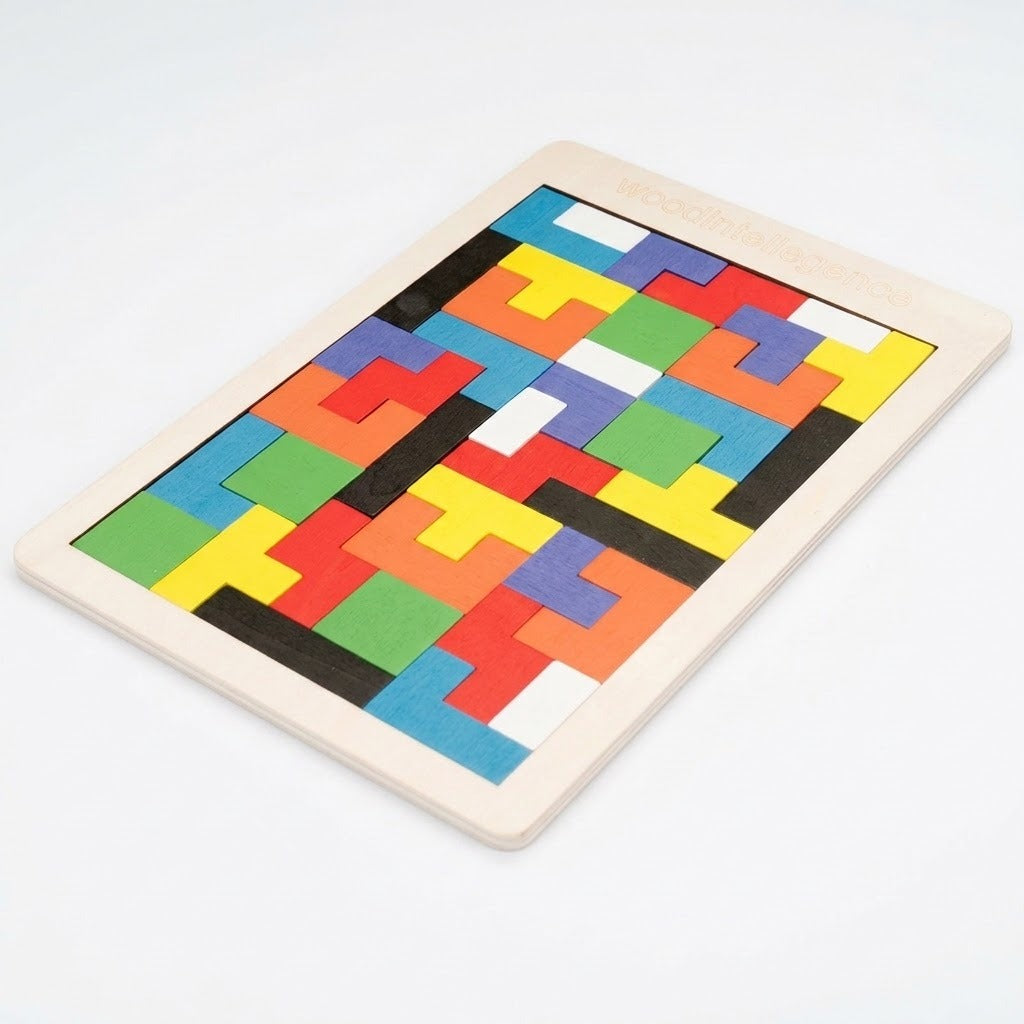 A completed wooden tangram puzzle displays multicolored geometric blocks in a rectangular frame, viewed diagonally against a white background.
