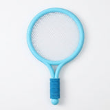 A light blue plastic racket from the toy racket set has white mesh and a dark blue grip against a white background.