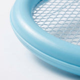 A close-up of the toy racket set shows a light blue plastic racket rim and pale mesh against a white background.
