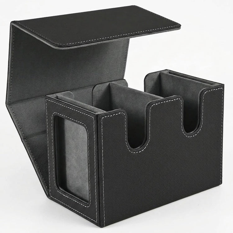 An open black-and-gray deck box with two empty compartments and a side display window stands against a white background.