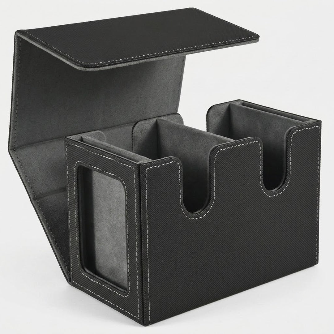 Black textured deck box with gray lining stands open on a white background, showing two compartments and a side display window.