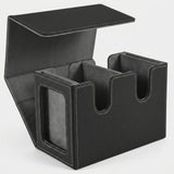 Black textured deck box with gray lining stands open on a white background, showing two compartments and a side display window.
