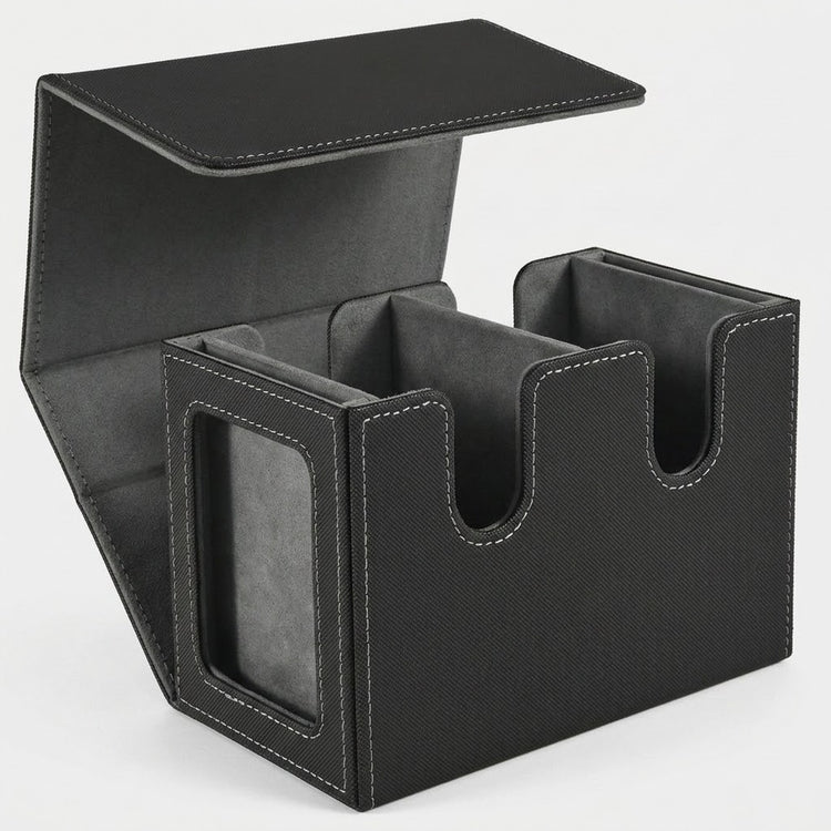 Black textured deck box with gray lining stands open on a white background, showing two compartments and a side display window.
