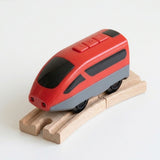 A red and gray toy high-speed train with black wheels, displayed on a curved wooden track against a clean white background.