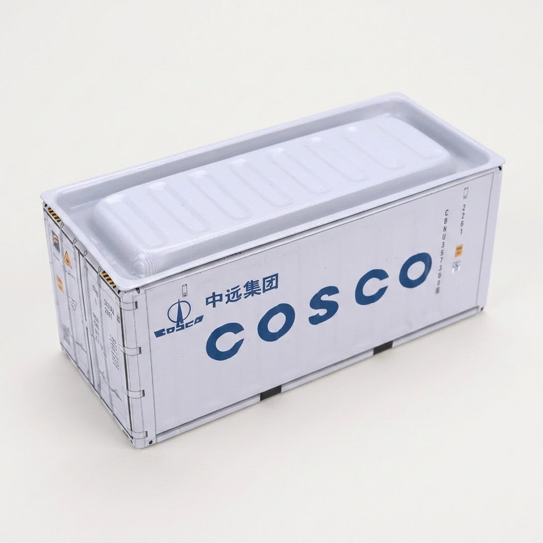 A white metal storage box with spaced navy lettering and a recessed lid sits against an off-white background.