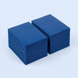 Two stacks of blue matte polypropylene card sleeves sit side by side on a pale blue background.