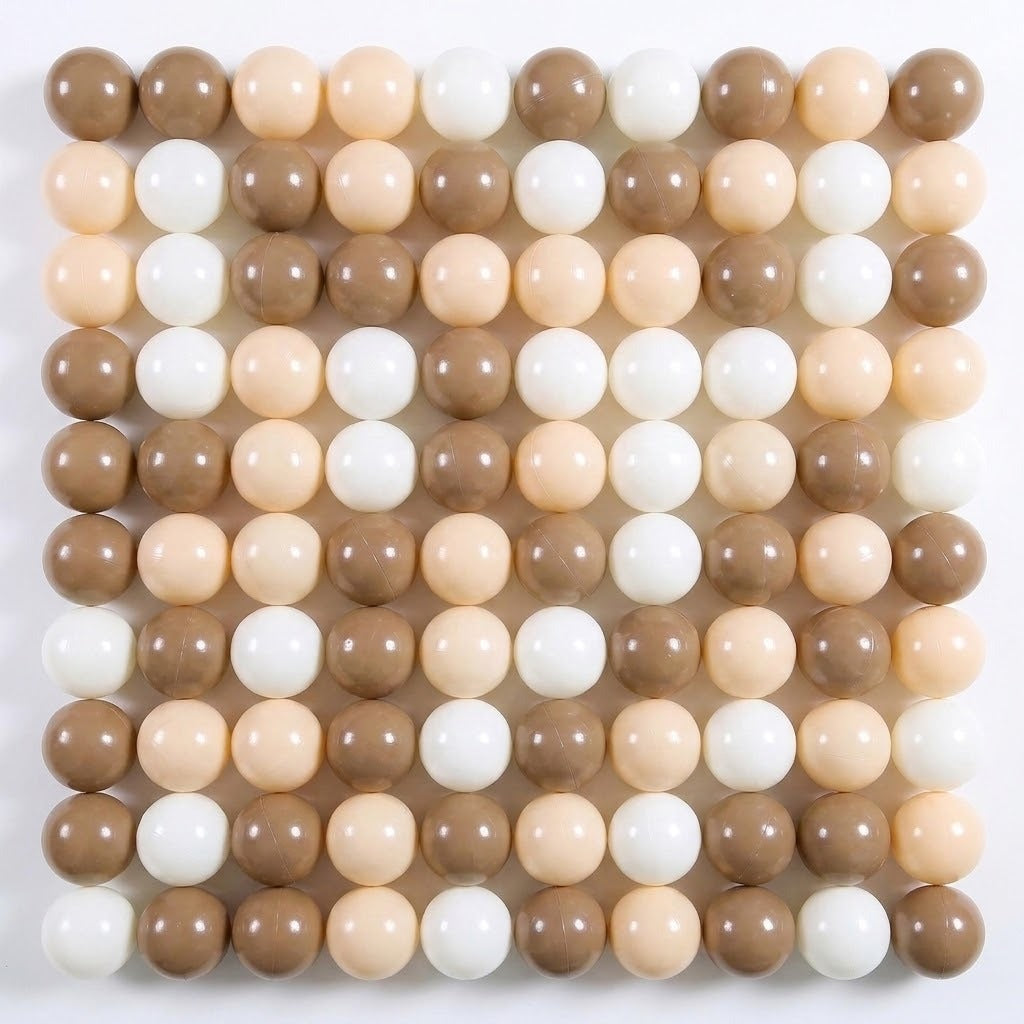 Glossy plastic ball pit balls in mocha brown, cream, and white form a square grid on a white background.