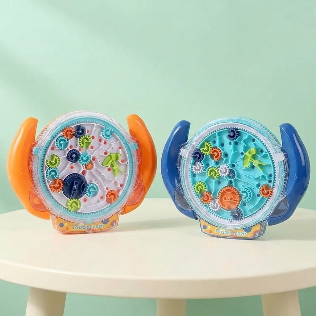Two round transparent plastic maze puzzle variants with orange and blue handles stand on a white table against a pale mint background.