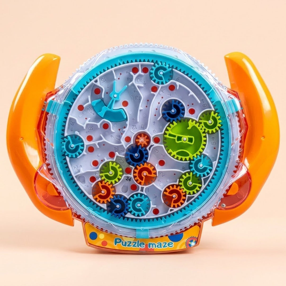 A colorful children's toy puzzle called 'Puzzle maze' with orange handles, a clear outer shell, and a white inner track featuring gears, wheels, and sliding pieces on a light beige background.