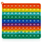 Rainbow silicone counting toy shows rows of numbered bubbles and a corner hanging loop against a white background.