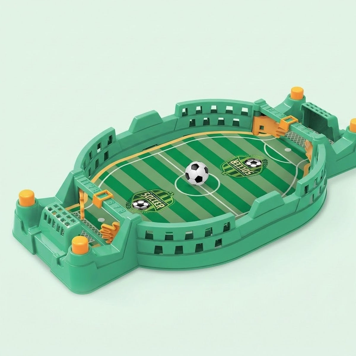 Green tabletop soccer game with a striped field, yellow controls, two goals, and a miniature ball against a pale green background.