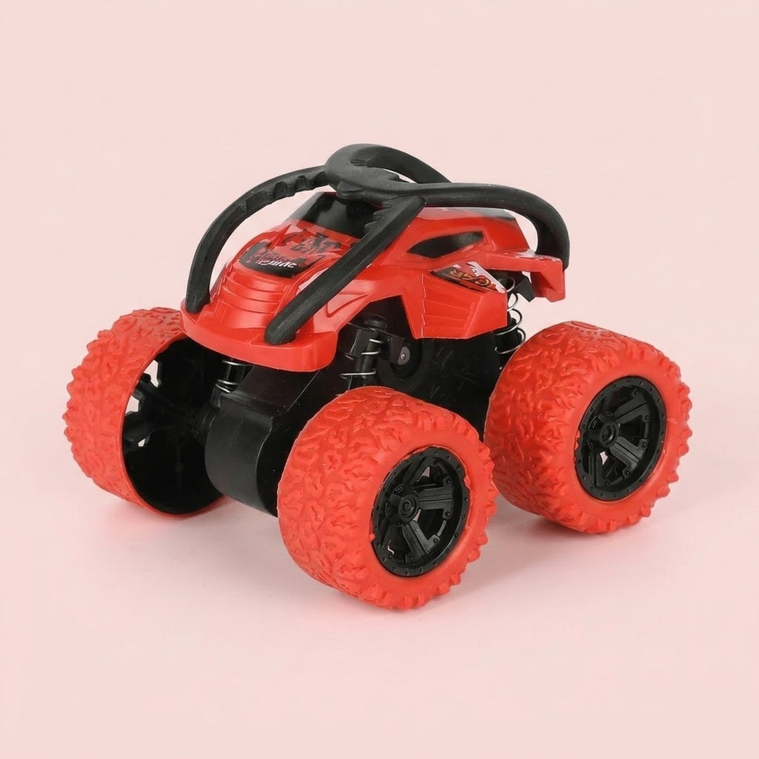 Red and black toy stunt car with chunky red tires, black overhead bars, and exposed springs against a pale pink background.