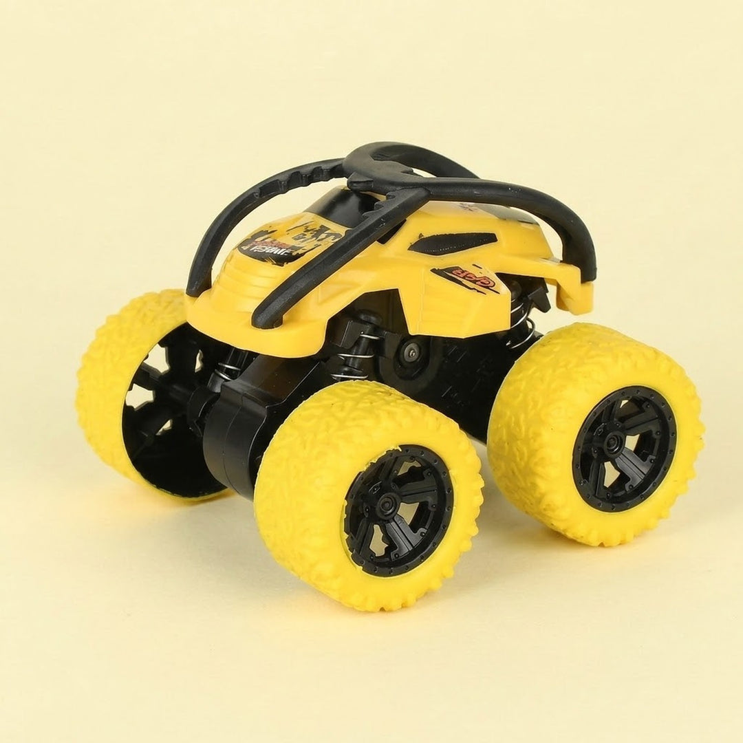 Yellow and black toy stunt car with chunky yellow tires, black overhead bars, and exposed springs against a pale yellow background.