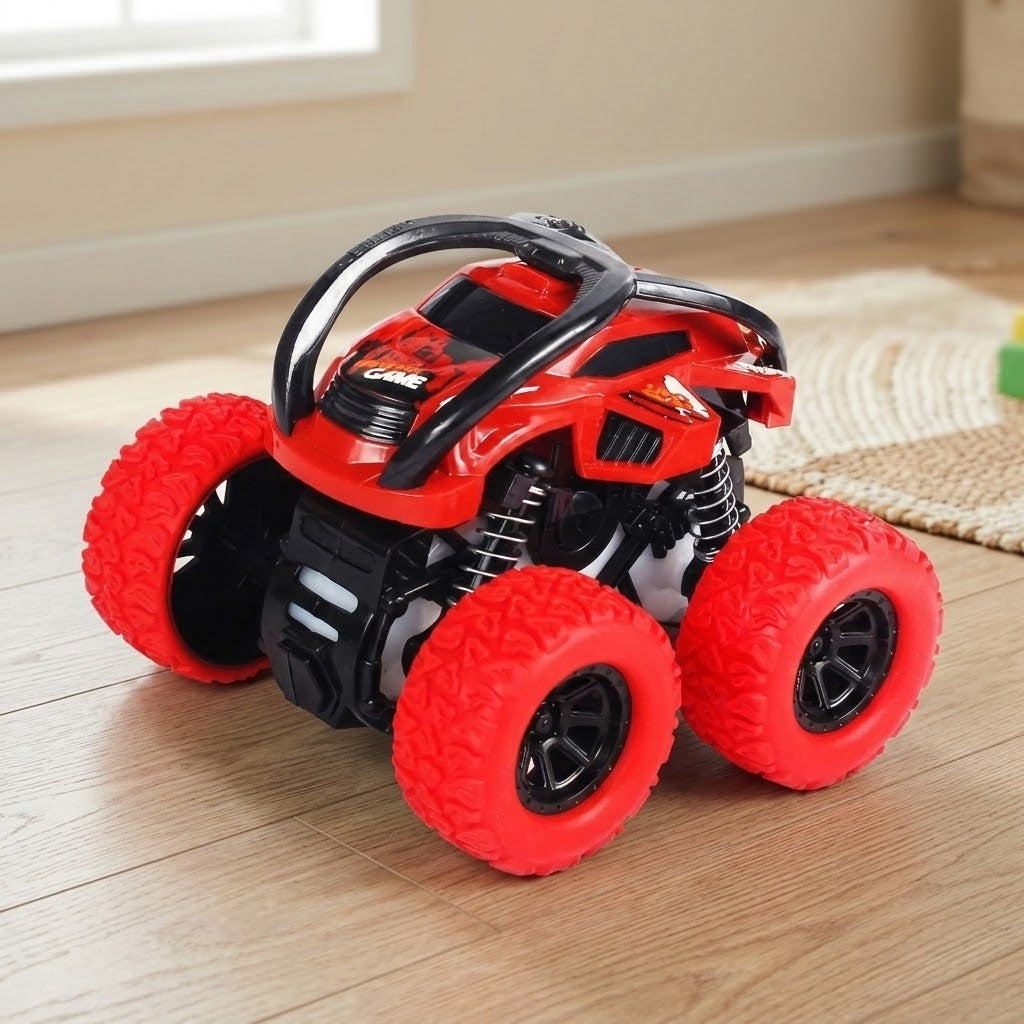 Red toy car with oversized red wheels, black protective bars, and visible suspension springs on a wooden floor beside a woven rug.