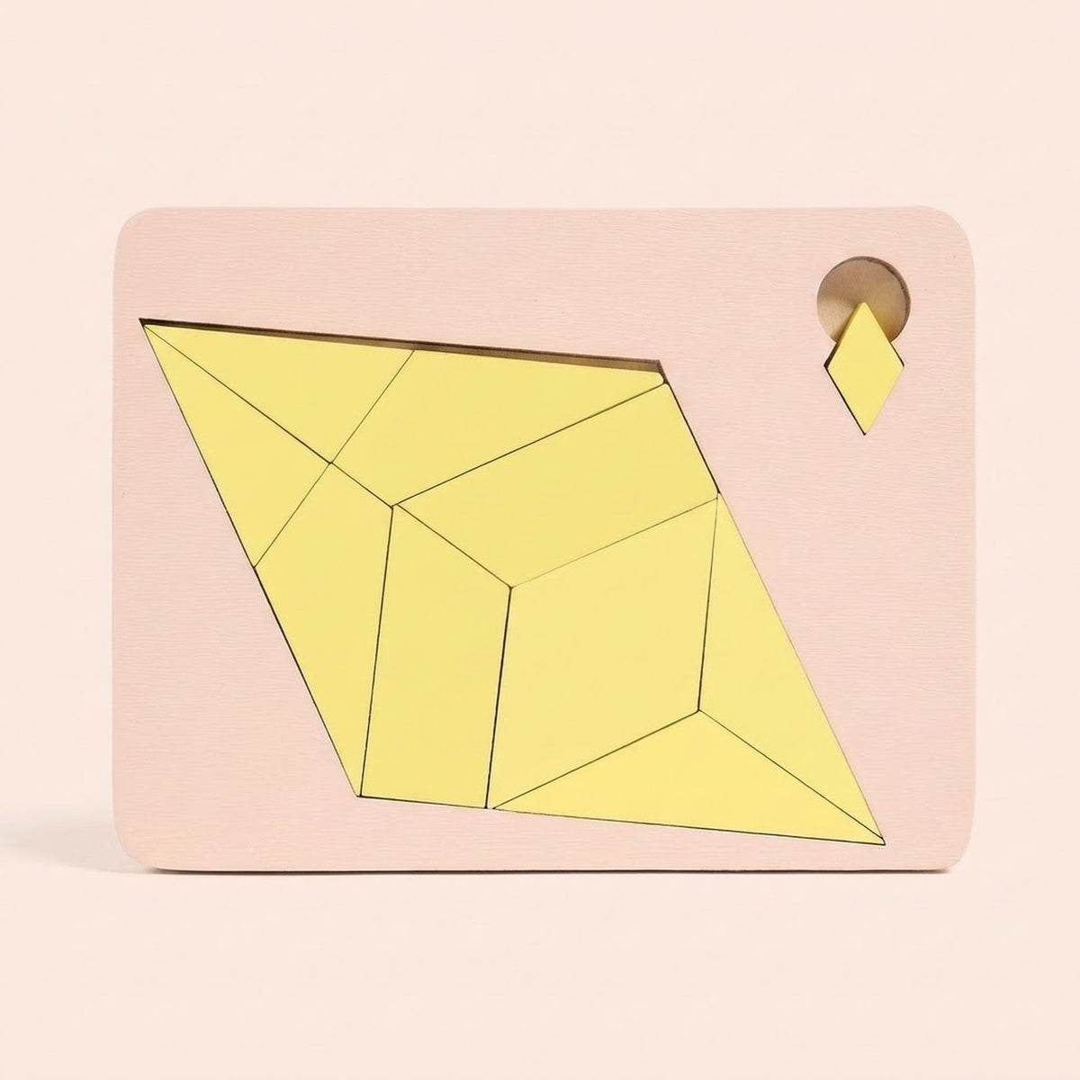 Yellow geometric pieces form a diamond inside a pale pink puzzle board with a small diamond tab against a peach background.