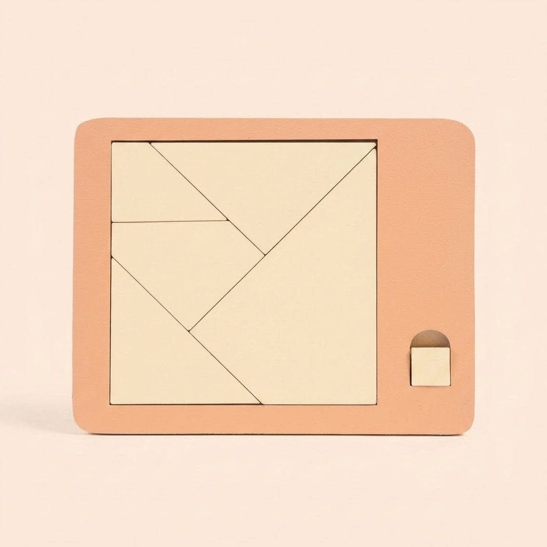 Cream geometric pieces form a square inside a peach puzzle board with a small square tab against a pale peach background.