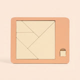 Cream geometric pieces form a square inside a peach puzzle board with a small square tab against a pale peach background.