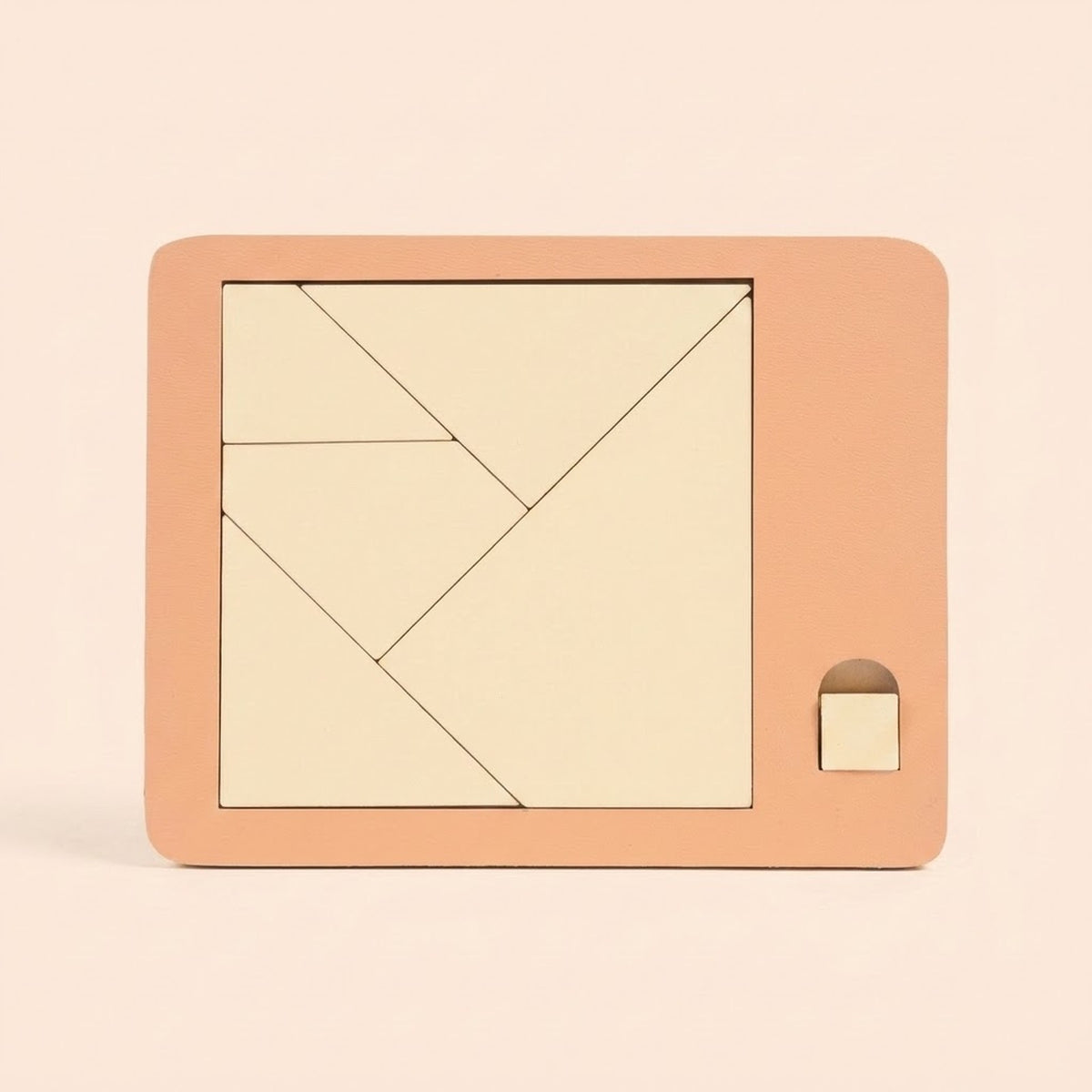 Cream geometric pieces form a square inside a peach puzzle board with a small square tab against a pale peach background.