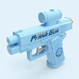 Light blue water gun with a cylindrical top attachment and orange rear detail, shown against a pale blue background.