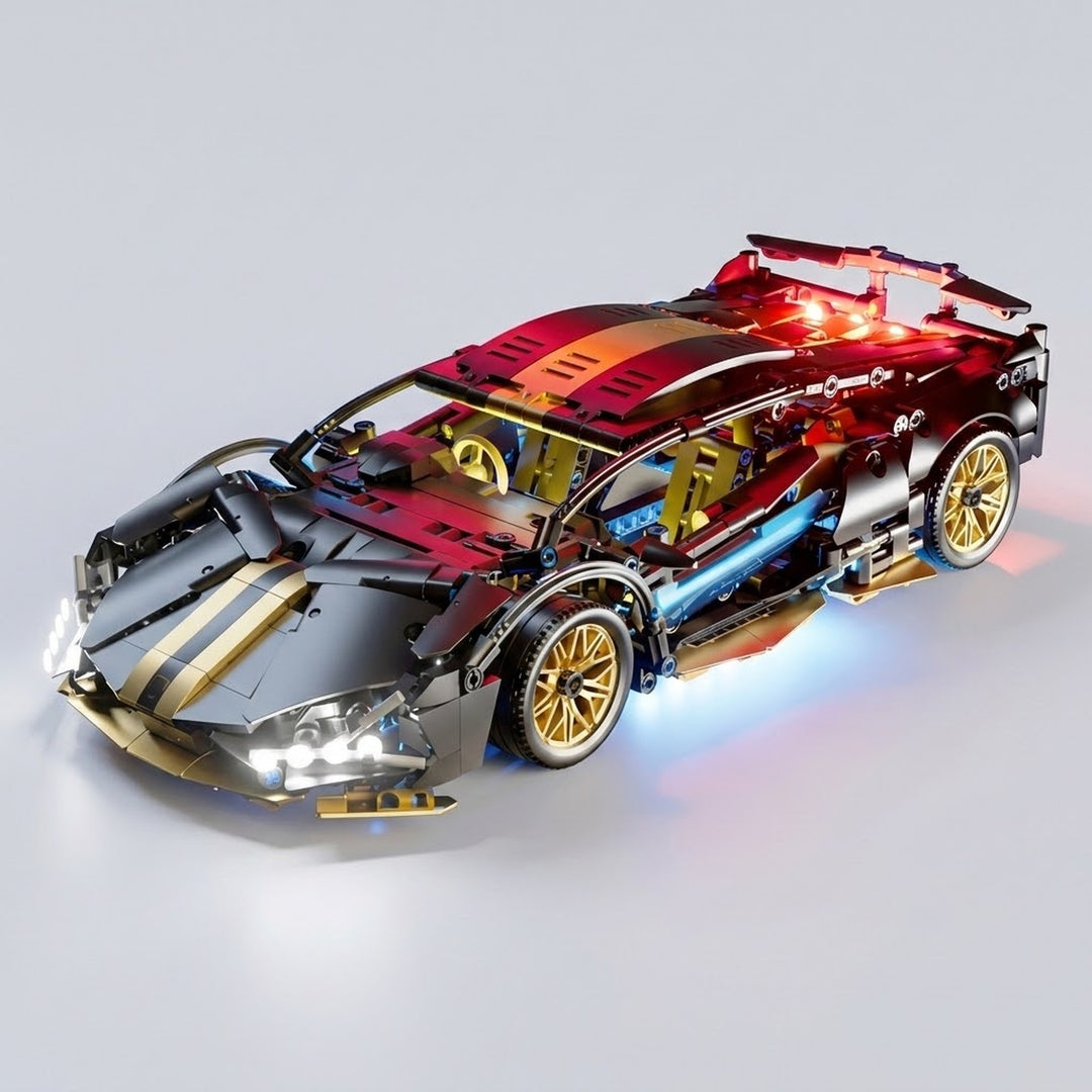 An assembled black and gold car building kit displays white headlights, red rear lighting, and blue underbody lighting against a light gray background.