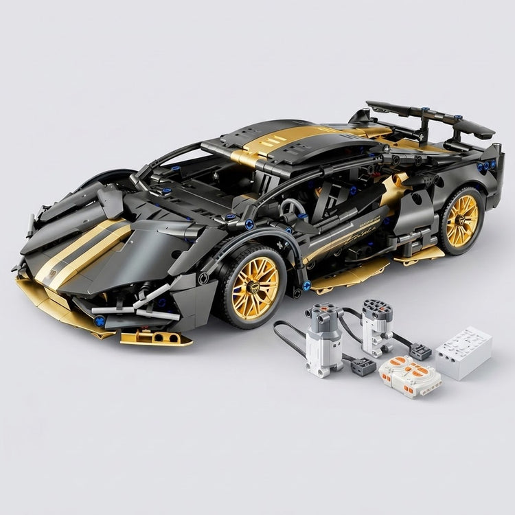 Black and gold car building kit stands assembled beside two wired motors and control components on a light gray background.